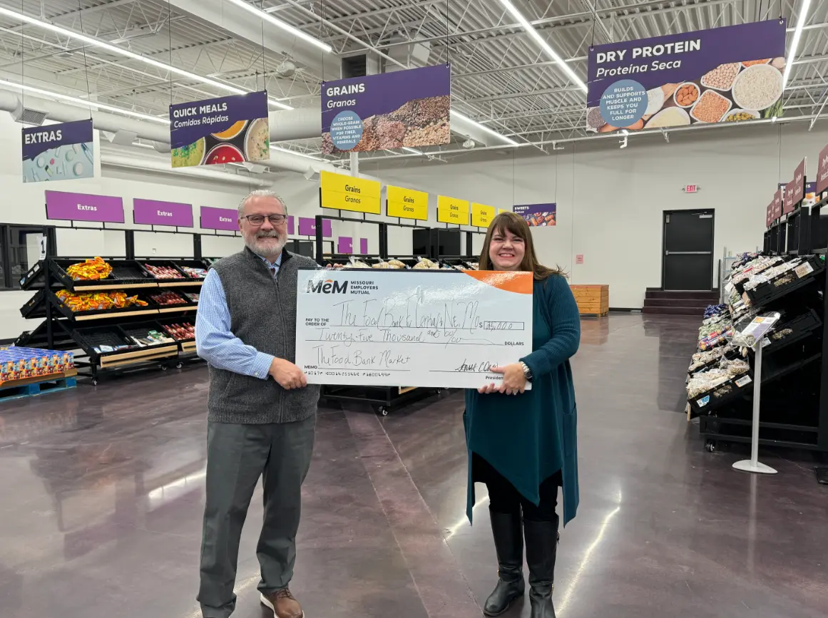MEM President and CEO, Roger Walleck recently presented Food Bank Executive Lindsay Lopez $25,000 for the MEM Matching Gift campaign for the Food Bank for Central and Northeast Missouri's Central Pantry.
