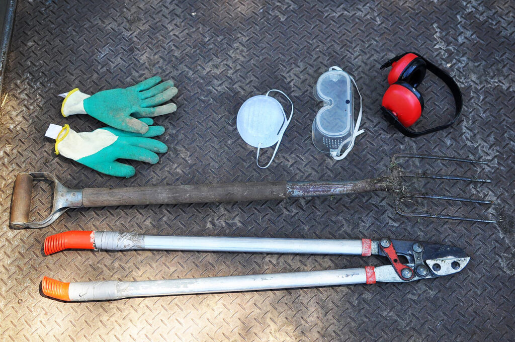 Garden tools, glove, mask, eyeglasses protector, earmuff, farm trident, compost fork, power pivot cut, lopper, in the truck