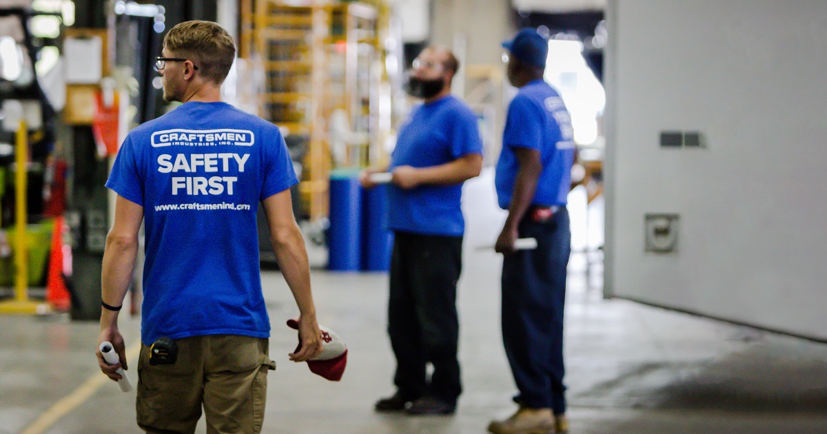 Worker wearing shirt that says "safety first"